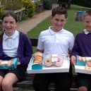Pupils at Our Lady and Saint Teresa's Catholic Primary School sold donuts to their classmates and wore their pyjamas to school to raise more than £300 for Warwick Hospital.
