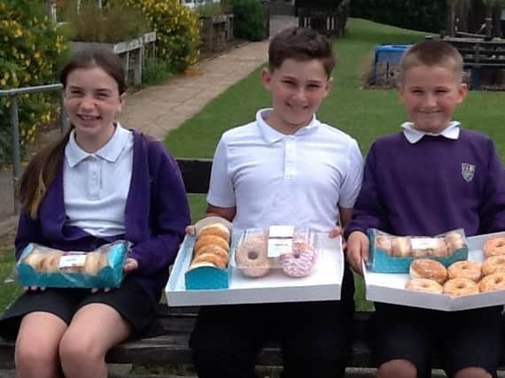 Pupils at Our Lady and Saint Teresa's Catholic Primary School sold donuts to their classmates and wore their pyjamas to school to raise more than £300 for Warwick Hospital.