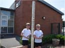 Standing next to their school’s Peace Pole, Ethan Flint and and Oliver Rist. Photo supplied