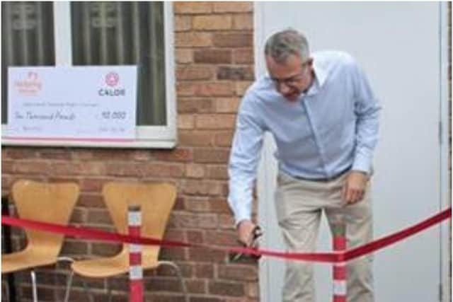 Matthew Hickin, CEO of Calor, officially opens the doors to the newly refurbished and renovated Helping Hands Esther Project in Leamington. Photo supplied