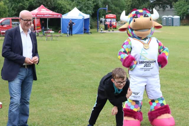 Youngsters enjoy the games on offer, alongside Matt Western MP and Perry the Bull.