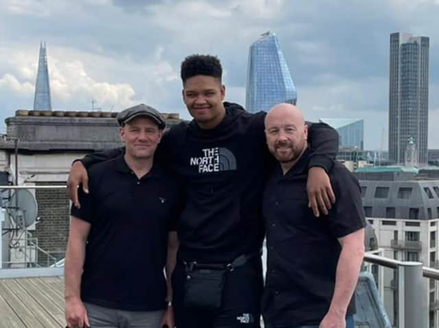 Cleary’s boxer Matty Harris with manager Max McCracken and trainer Edwin Cleary on top  of Wasserman HQ in London