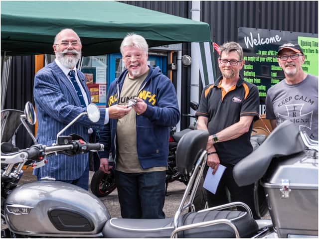 Norman Hyde hands the keys to Simon with Hank and Robin of Trike Design. Photo by Tony Smith