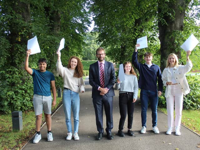 (Left to right) Prajeet Prabakaran, Charlotte Lister, Ed Hester (headmaster), Carmel Spelman, James Gallagher and Grace McGrory