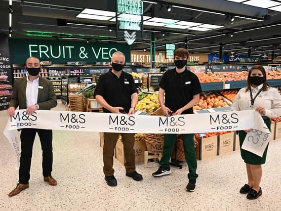 Manager Russ Tatton (left) and staff cut the ribbon to open the new M&S Food store at Leamington Shopping Park today (Wednesday, August 11).
