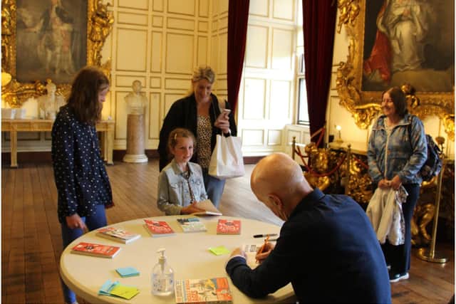 Terry Deary, Author of Horrible Histories, meets fans during book signing in Warwick Castle’s State Dining Room. Photo by Warwick Castle