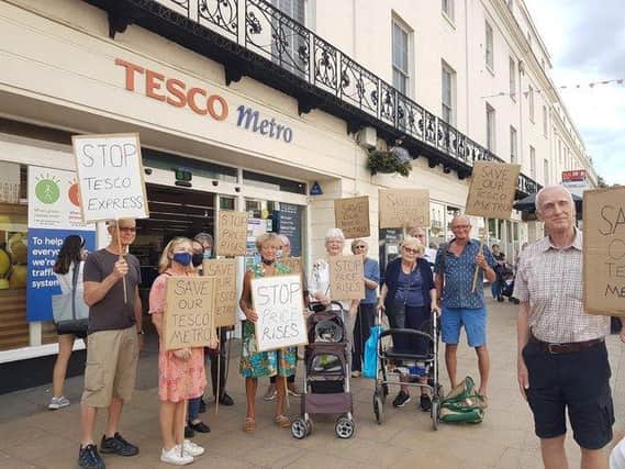 Shoppers protest outside Tesco in the Parade, Leamington, to show their opposition to the rebranding of the store from a Metro to an Express branch which has led to price hikes on many products.