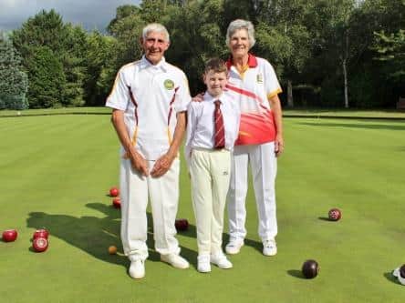 Ladies County President Mary Wheildon with Roy Allen aged 90 and Jacob Green aged 11 proving bowls is a game for all ages