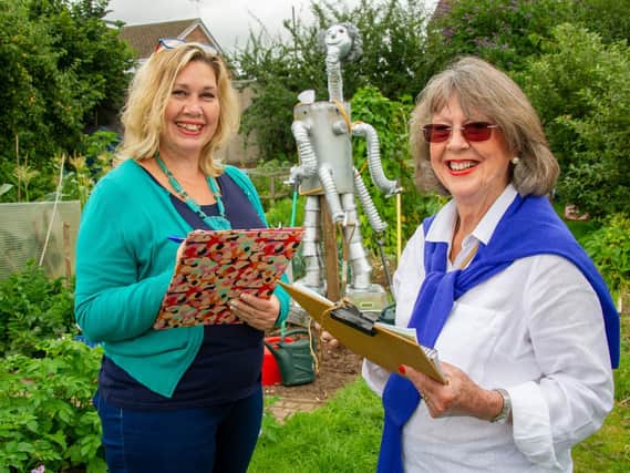 Maggie Field, Kenilworth Town Clerk and Lily Brownjohn, secretary for the Kenilworth Allotment Tenant’s Association, judge the scarecrows before the Odibourne Allotment site Open Day event on Sunday (August 22).