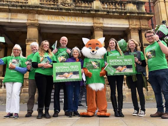 Volunteers and staff from the national animal welfare charity the League Against Cruel Sports, including one in a fox costume, gathered outside Leamington Town Hall today to urge the public to take action and sign up to its National Trust campaign.