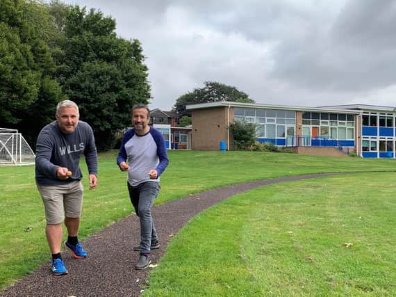 Cllr Jody Tracey and Cllr Oliver Jacques and taking park in an egg and spoon race at All Saints School in Warwick on their new all weather track. Photo supplied