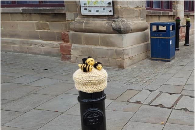 Some of the knitted bollard covers for the bollards around the museum. Photo supplied