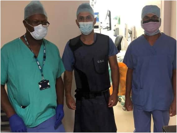 Left to right: Dr Emert White, consultant anaesthetist, Mr Gurdip Chahal, trauma and orthopaedic consultant, and Mr Ajay Chourasia, orthopaedic registrar pictured after the operation. Photo supplied