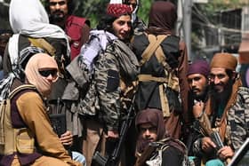 Taliban fighters patrol in a vehicle along a street in Kabul on September 2, 2021. (Photo by Aamir QURESHI / AFP) (Photo by AAMIR QURESHI/AFP via Getty Images)