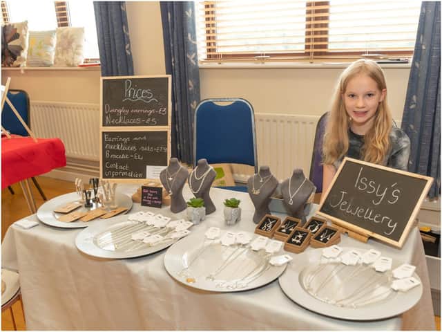 Issy Foyle, 12, with her handmade jewellery stall. Photo by Victoria Jane Photography