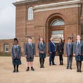 Principal Michael McCulley, plus vice principal Chloe Buckenham with students on the opening day.