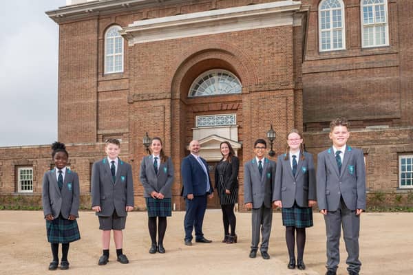 Principal Michael McCulley, plus vice principal Chloe Buckenham with students on the opening day.