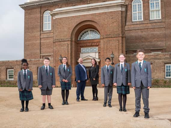 Principal Michael McCulley, plus vice principal Chloe Buckenham with students on the opening day.