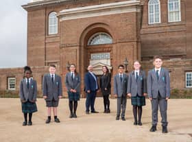 Principal Michael McCulley, plus vice principal Chloe Buckenham with students on the opening day.