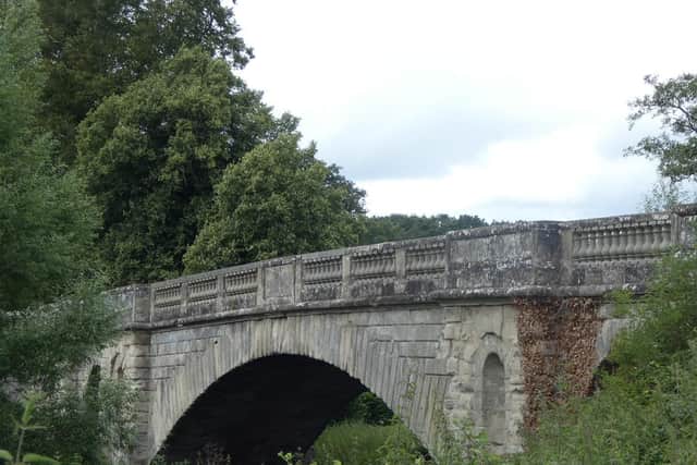The 19 th century Rennie Bridge at Stoneleigh Abbey