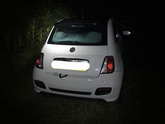 An uninsured driver was found asleep in car near Rugby - with Class A drugs on the back seat.