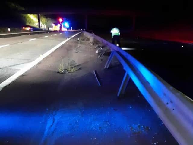 A driver of a VW Passat collided with the central barrier - and then collided into the back of another vehicle, causing that car to leave the road and go up onto a grass embankment. Photo by OPU Warwickshire.
