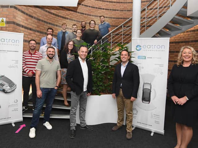 Eatron Technologies staff with Jane Talbot. Pictured: Umut Genc (front row, second left), Amedeo Bianchimano (front row, second right) and Jane Talbot (front row, right). Photo supplied