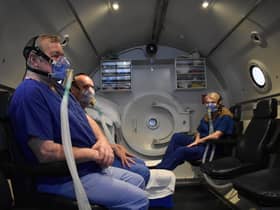 Patients prepare for treatment in the chamber.