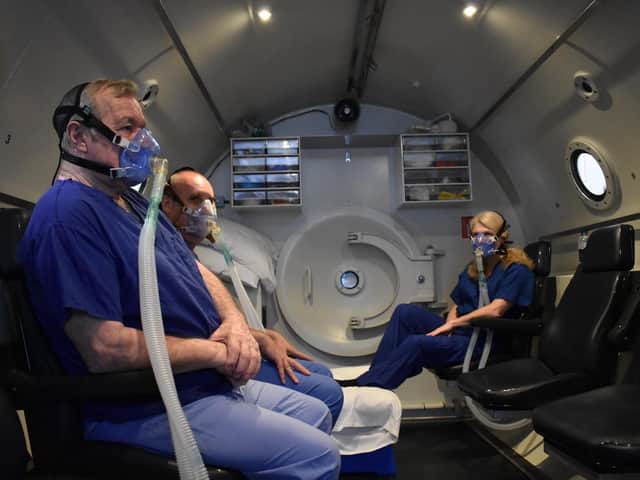 Patients prepare for treatment in the chamber.