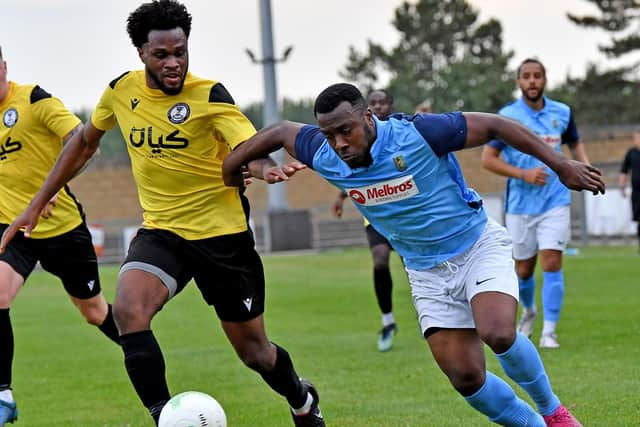 New signing Lamar Parkes drives into the box