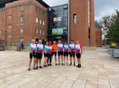 The team outside the Royal Shakespeare Theatre in Stratford after completing their cycling challenge. Photo supplied