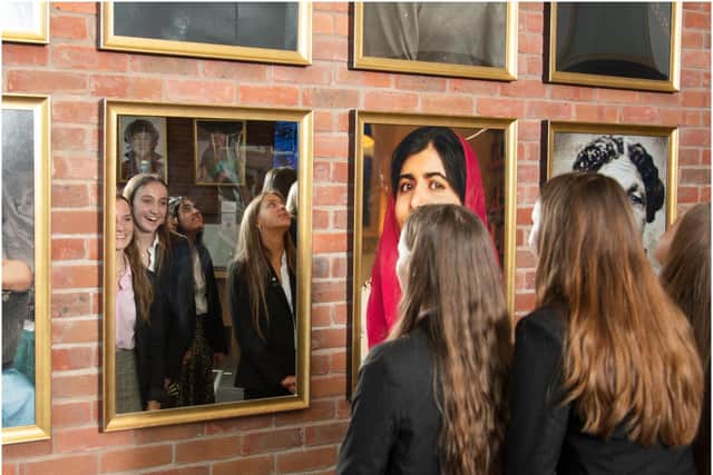Pupils examine the mirror in the new changemaker gallery at King’s High. Photo supplied
