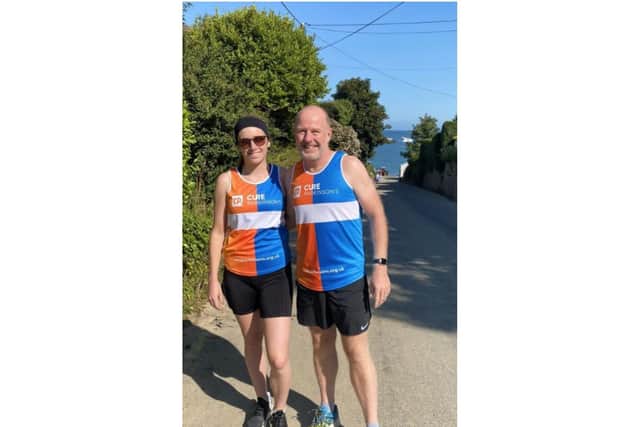 Mike Mulholland (53) and his daughter, Lily (25), will be teaming up to run the iconic marathon, to help raise money for Cure Parkinson’s. Photo supplied