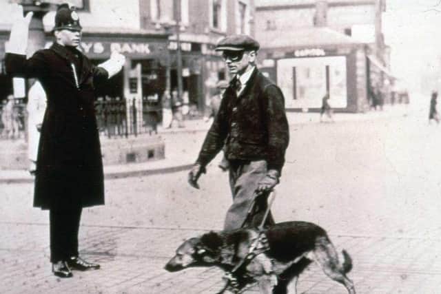 A guide dog trainer in the early 1930s