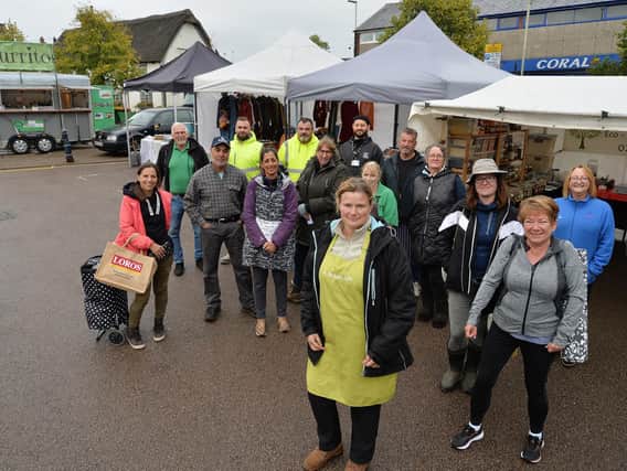 Market trader Elaine Wakelam with supporters and other traders at Lutterworth Market.
PICTURE: ANDREW CARPENTER