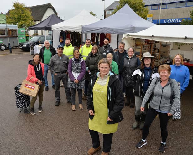 Market trader Elaine Wakelam with supporters and other traders at Lutterworth Market.
PICTURE: ANDREW CARPENTER