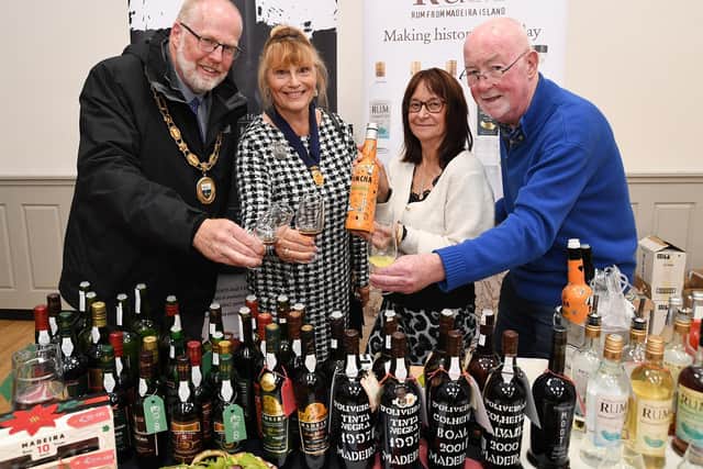 Lutterworth Mayor Cllr Richard Nunn and Pat Nunn, Lesley Adams of Lanes Fine Deli and organiser Tony Hiron during the Lutterworth wine fair.
PICTURE: ANDREW CARPENTER