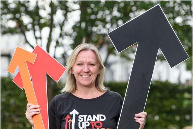 Warwick mum and breast cancer survivor Louise Roberts will be standing up for 13 hours on October 13 to raise money for Stand Up To Cancer’s life-saving research – four years to the day since she rang the bell for the end of treatment. Photo supplied