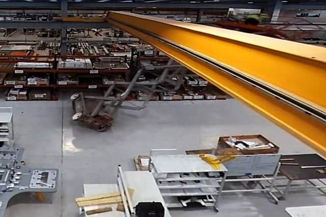 A still image from the CCTV footage showing the moment a worker fell from a scissor lift and fractured his skull, leaving him in an induced coma.