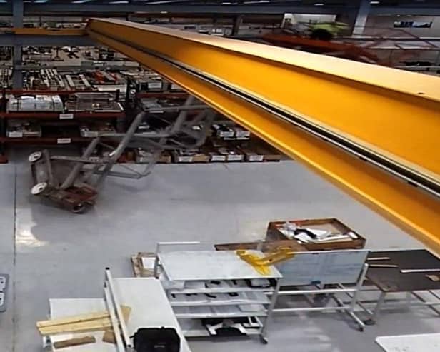 A still image from the CCTV footage showing the moment a worker fell from a scissor lift and fractured his skull, leaving him in an induced coma.