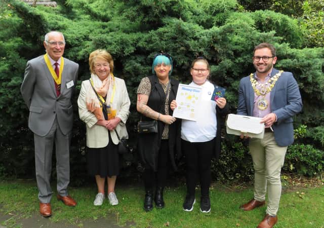 Pictured from right to left: Warwick Mayor Cllr Richard Edgington with a Rotary Shoebox, Tilly-Rea Blackburn and her mother, Margaret Morley, and Warwick Rotary President-Elect Keith Talbot. Photo supplied