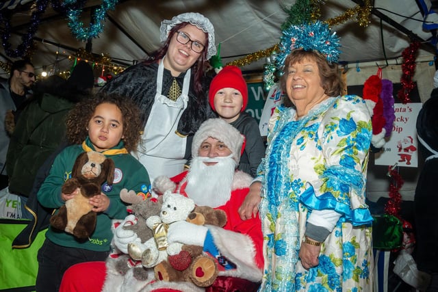 The annual Warwick Victorian Evening and Christmas Light Switch On took place recently, with numerous stalls and attractions for visitors to the town centre celebrations.
Pictured:James, Izzy Dane, Keegan, Pam Hinks & Andrew Martin ( 7th Warwick Woodloes Cubs).
Photo by Mike Baker