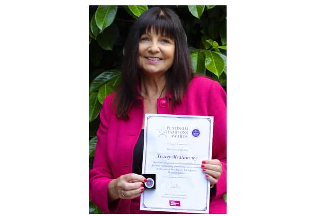 Tracey McAtamney with her Platinum Champion Award from The Royal Voluntary Service. Photo by Dy Holmes