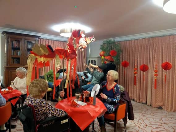 Residents and staff at the Leycester House care home in Warwick recently marked the Chinese New Year with an event featuring a dragon dance, a talk and food. Photo supplied