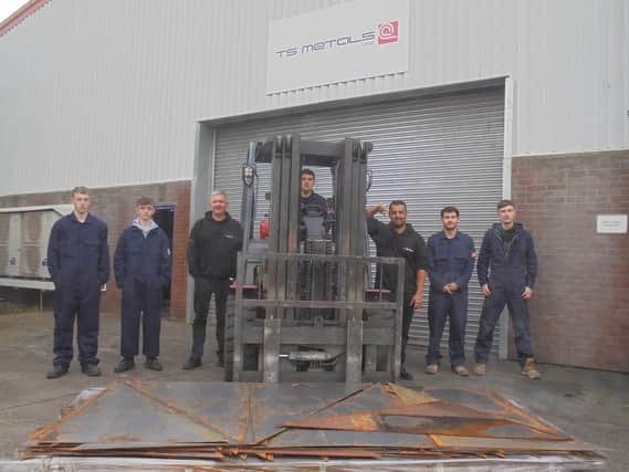 From left to right, Joshua Allan, Liam Holt, Ian Addison, Cameron Blay, Valter Bras, Gareth Lloyd and Alfie Ainley at TS Metals preparing to deliver their donation of materials.