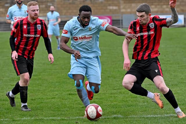 Rugby Town's Madundo Semahimbo drives into the Spalding box (Picture: Martin Pulley)