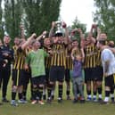 Hawkes Mill Sports celebrate winning the Division One title trophy.