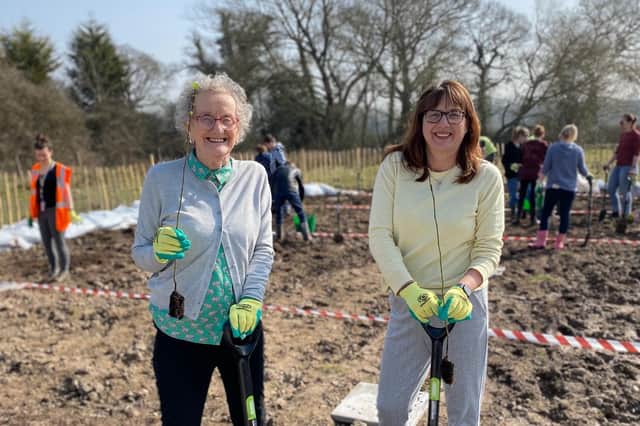 Northleigh House School’s Founder, Viv Morgan and Headteacher, Elaine Simmonds joining in with the tree planting. Photo supplied