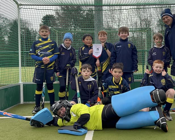 Rugby & East Warwickshire's Under-10s hockey players celebrate their county championship success