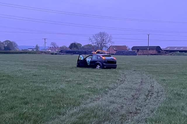 The car chase ended with the car abandoned in a field but the driver was caught nearby. Photo: Warwickshire Police